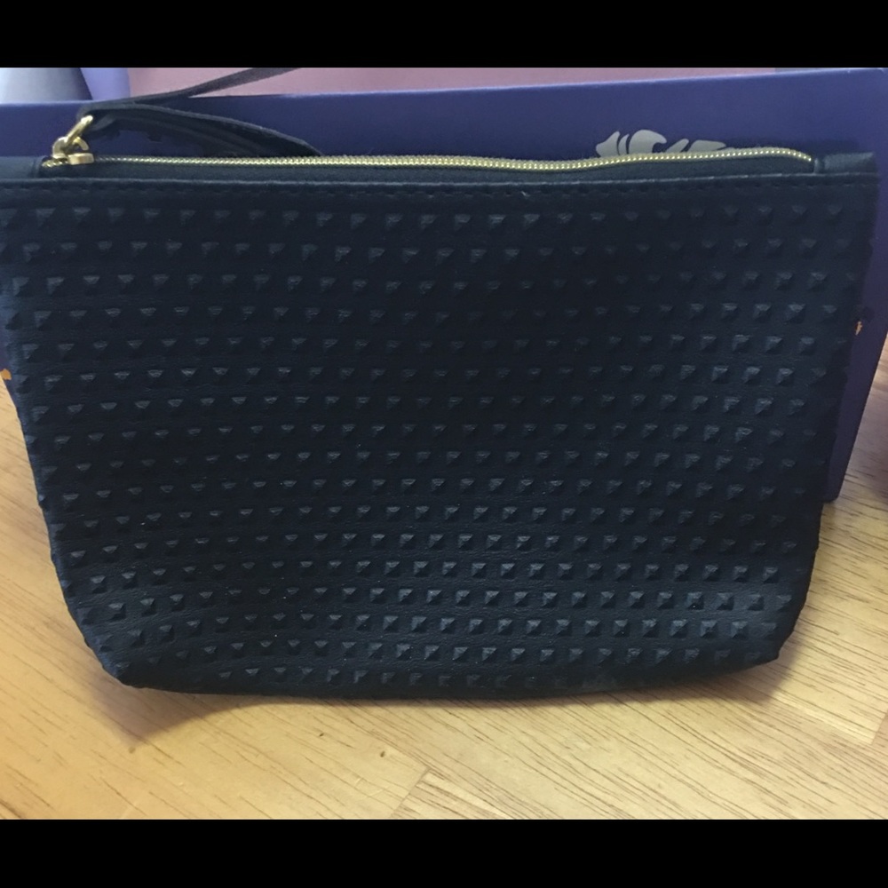 Beauty bag w/ at least 4 surprise makeup samples..